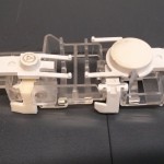 Good as new. Same button mechanism, now with two levers.