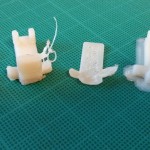 L-R: original part, two failed prints, successful print