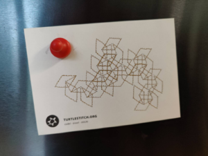 A postcard embroidered with repeating diamonds. In the corner is the turtlestitch website and logo. 